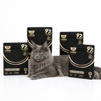 Golden Bowl complete and balanced freeze-dried raw cat food value proposition infographic. Six identical 10g single-serving pouches arranged in a grid, each labeled with the brand name and key claims. Main selling points emphasized: 100% animal-based ingredients, 0% starch, 0% grains, and 0% chemical attractants or artificial palatants. Positioned as a whole-prey raw diet freeze-dried staple for cats—nutritionally complete, species-appropriate, and free from common fillers and synthetic appetite stimulants.